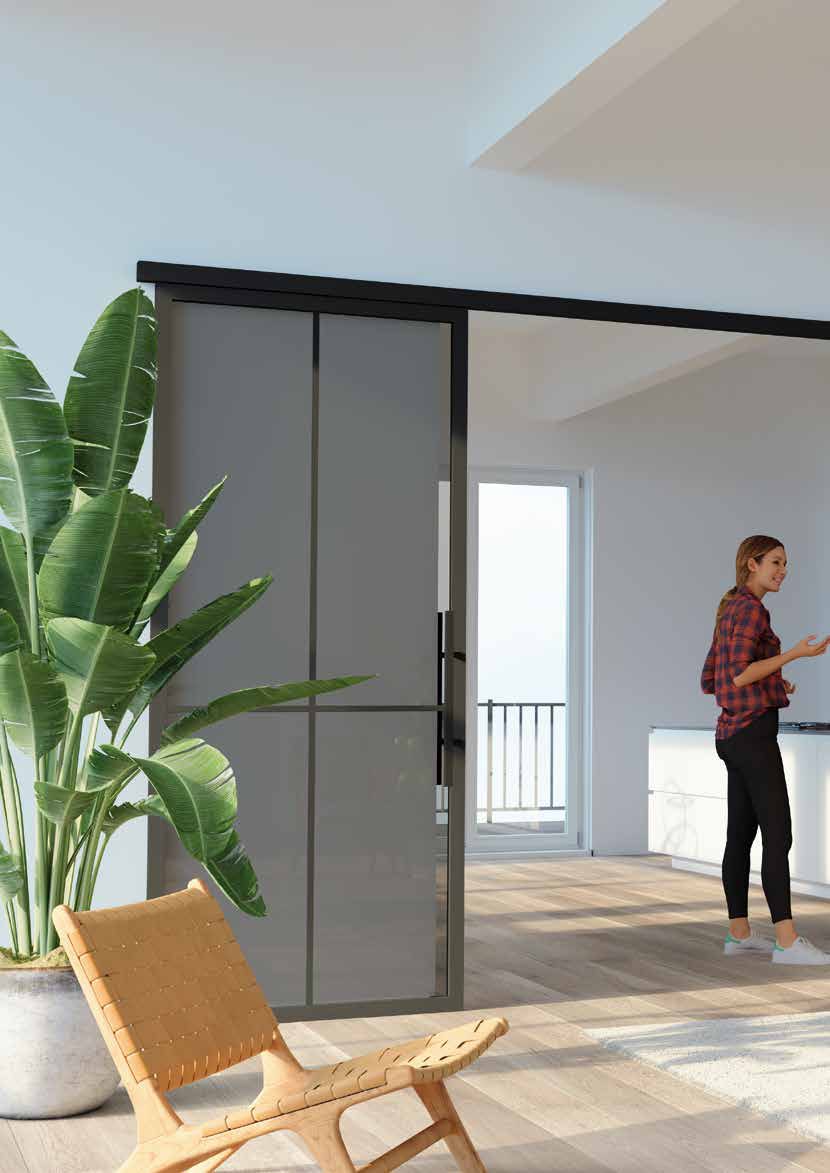 Schiebetür mit grauem Glas trennt Arbeitsbereich ab