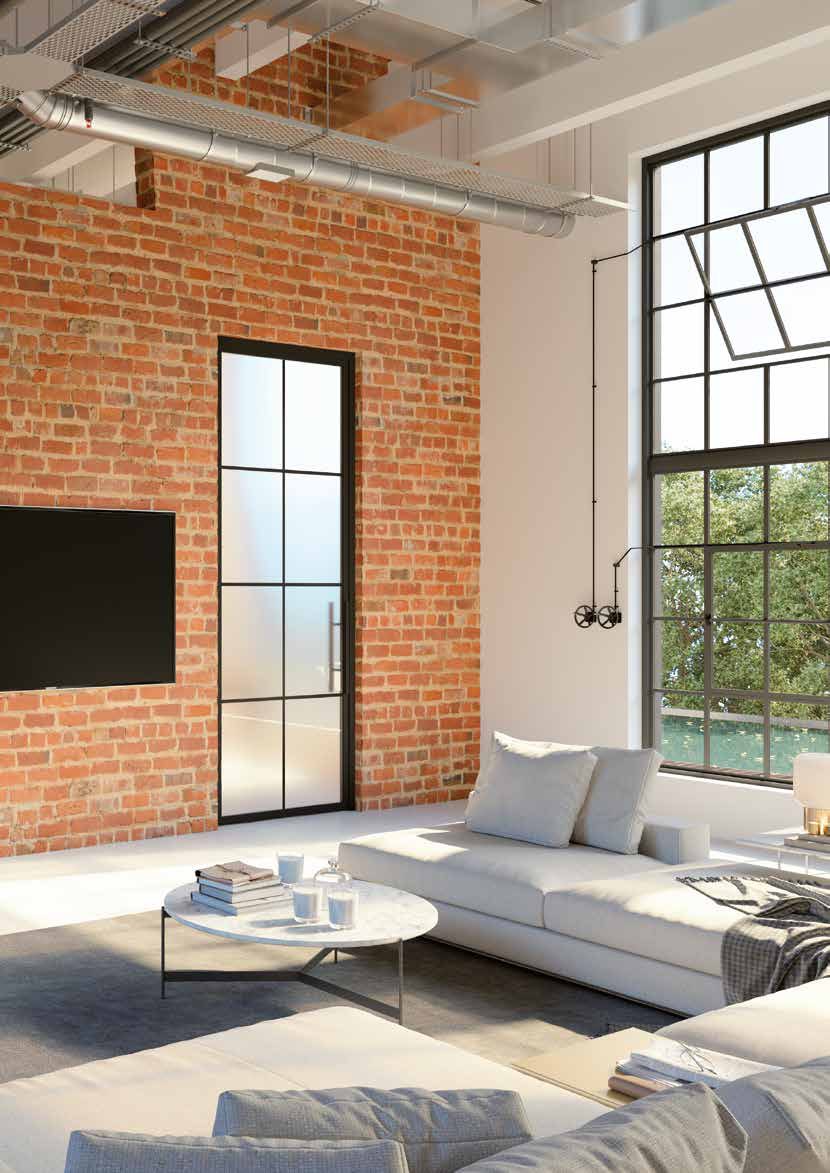 Framework Festverglasung im Loft mit Backsteinwand